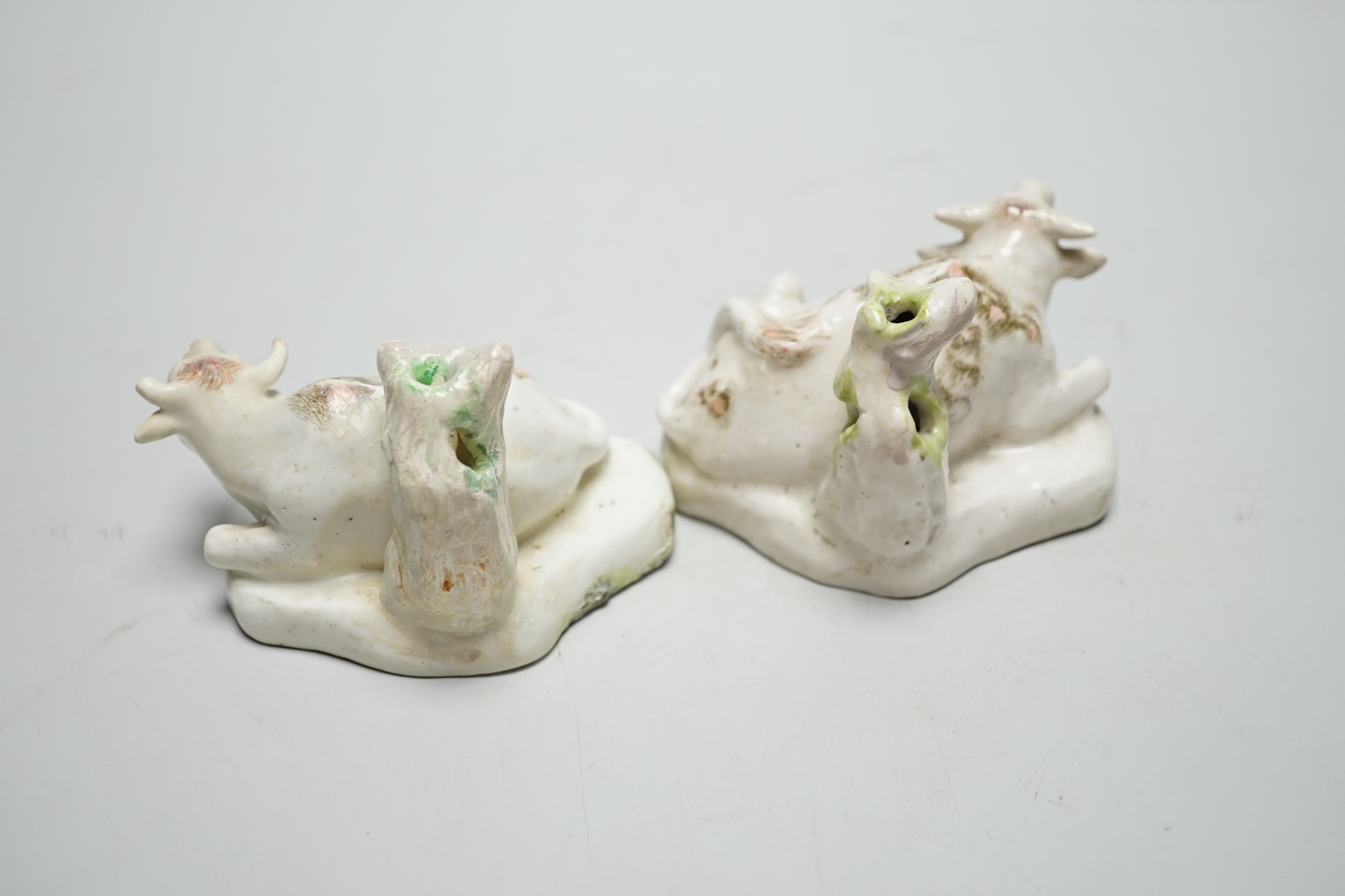 A pair of Derby figures of lowing cows, c.1760-5, 7cm tall